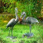 Bronzeskulptur "Graureiher-Paar mit Fisch"
